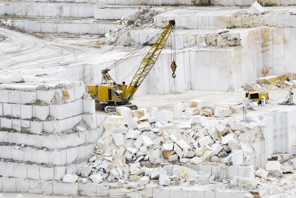 Crane and white marble blocks