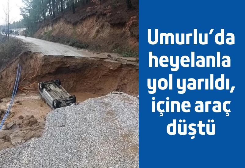 Umurlu'da heyelanla yol yarıldı, içine araç düştü